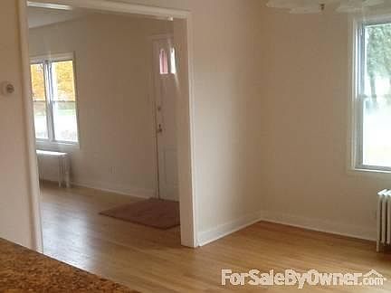 Dining Rm and Living Rm
						:
						Pix is taken from standing at the half wall in between the kitchen and dining rm