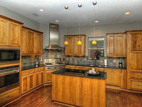 Chef's kitchen featuring Wolf, Sub-Zero and Asko appliances.