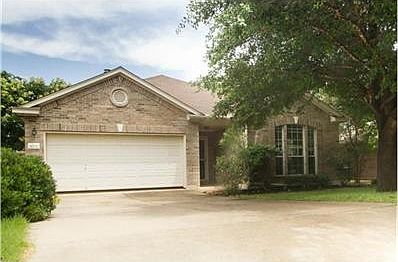Beautiful single level home in Cat Hollow on tree'd lot and back