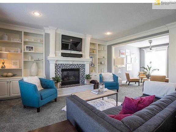 Family Room with Built In Cabinetry & New Glass Tile Surround