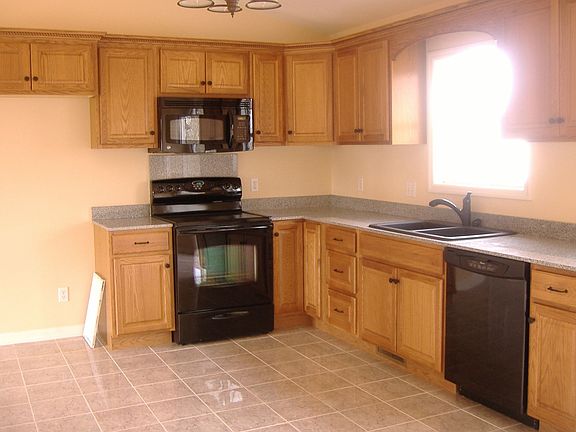 Ceramic tile, beautiful moldings on cabinets