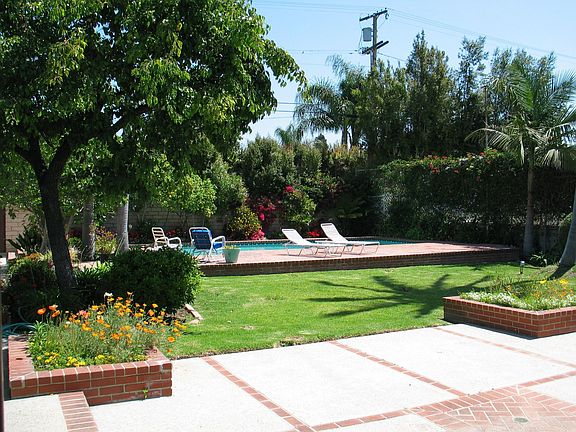 Yard with pool and spa