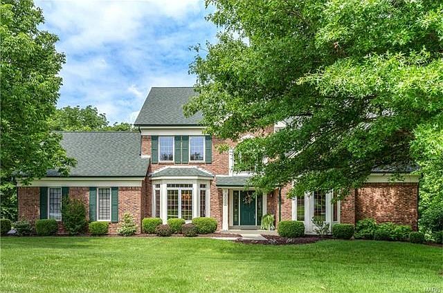 Postcard perfect! Impressive 1.5 story on 1+ acre lot in Radcliffe Place.