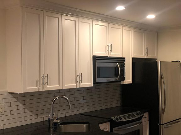 Newly renovated gourmet kitchen with stainless steel appliances.