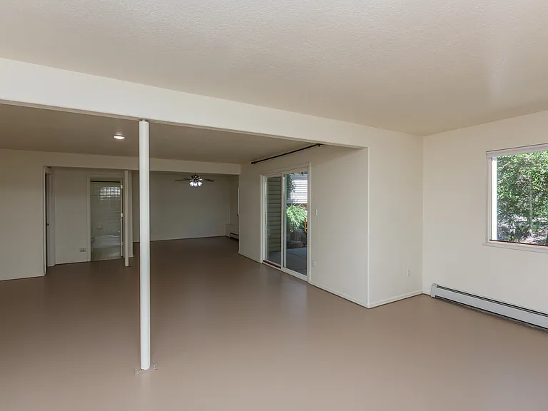 Basement living space w/ sliding door to back patio