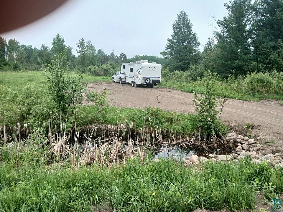 2nd image of 7473 Comstock Lake Rd Lot #3 behind 7473