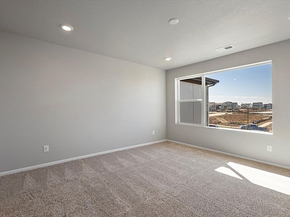 A primary bedroom perfect for unwinding after a long day.