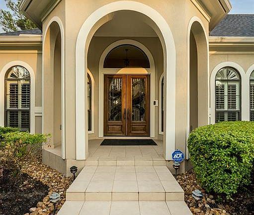 Stunning approach to the custom double front doors.