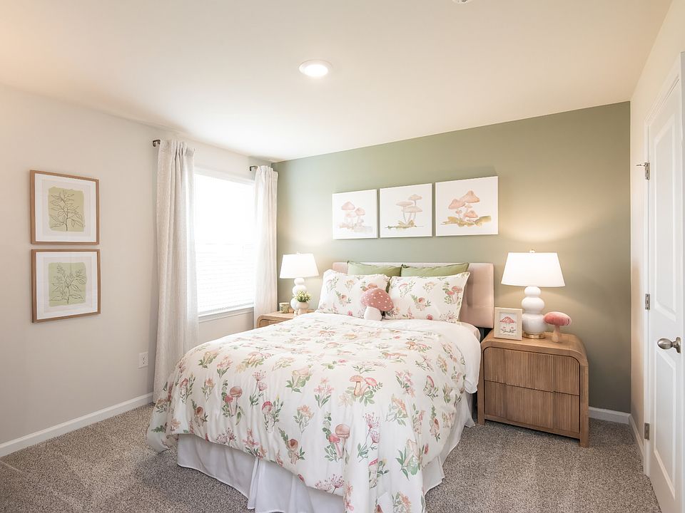 The Dakota floorplan with the Divine White interior package modeled at Walkers Hill.