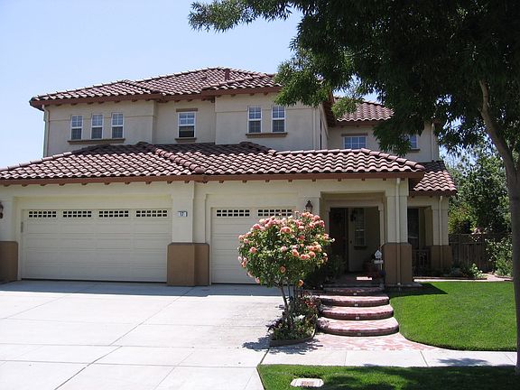 Three car garage and custom brickwork steps
