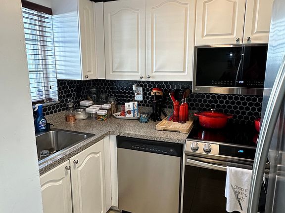Newly Renovated Kitchen with Wood Cabinets and Stainless Steel Appliances