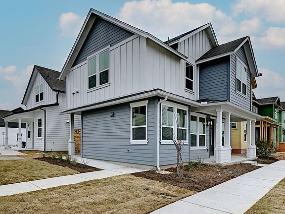 Side face is east. Nice sitting porch. 1st floor left windows are kitchen, middle front window dining. Second floor large right window is master bedroom, middle window upstairs office, left east window is second bedroom.