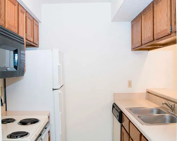 Everything you need within reachthis galley kitchen offers full-size appliances, a double basin sink, and plenty of cabinet space.