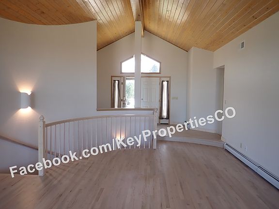 Entryway, foyer, curved staircase to downstairs