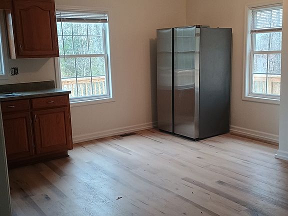 Kitchen with new flooring and paint.