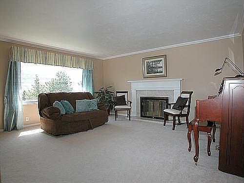 Formal Living and dining room with cozy fireplace
