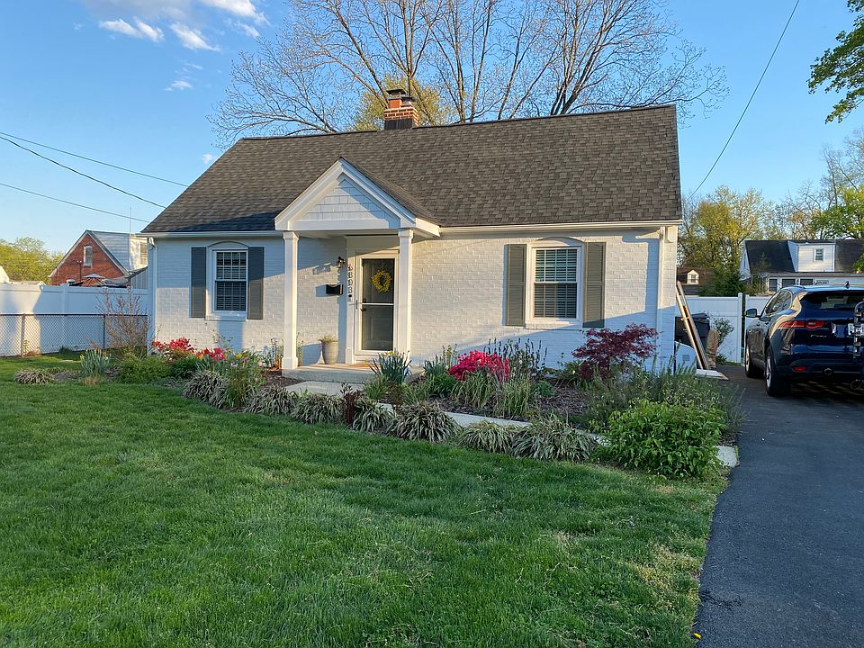 Cape style home with off street parking and beautiful landscaping