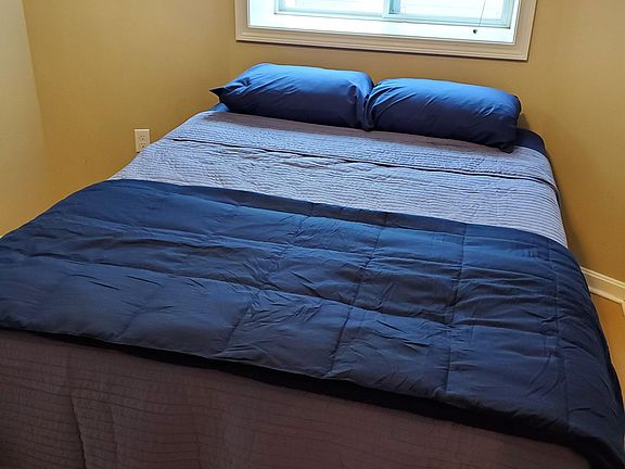 Bedroom with brand new queen size bed