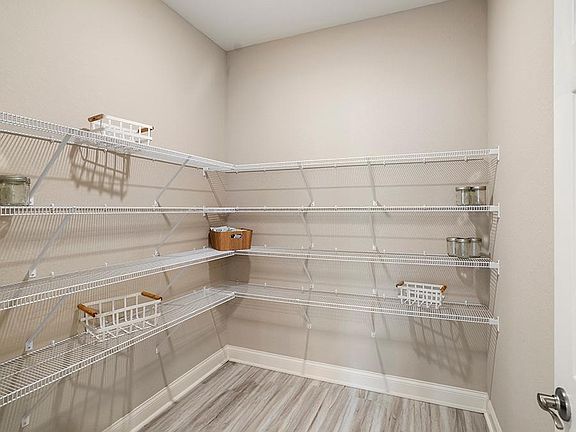 Enjoy the storage convenience of a walk-in pantry.