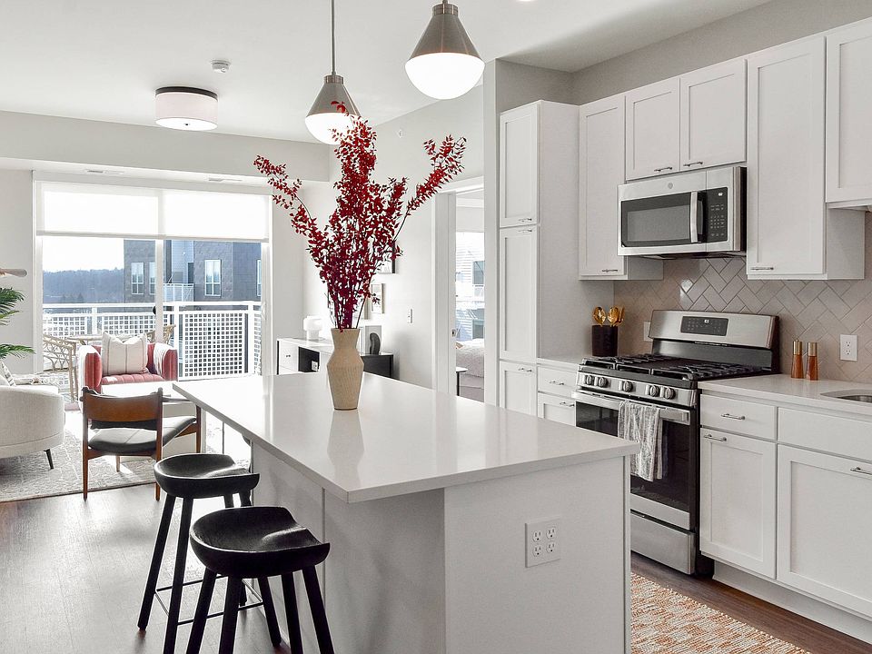 Elegance meets functionality in this stunning kitchen at The Hallon luxury apartments in Hopkins, MN