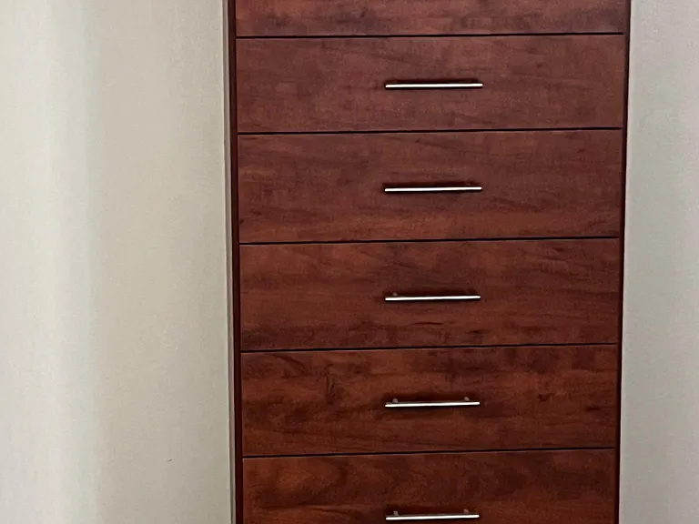 Custom closet organizing system with drawers in each bedroom