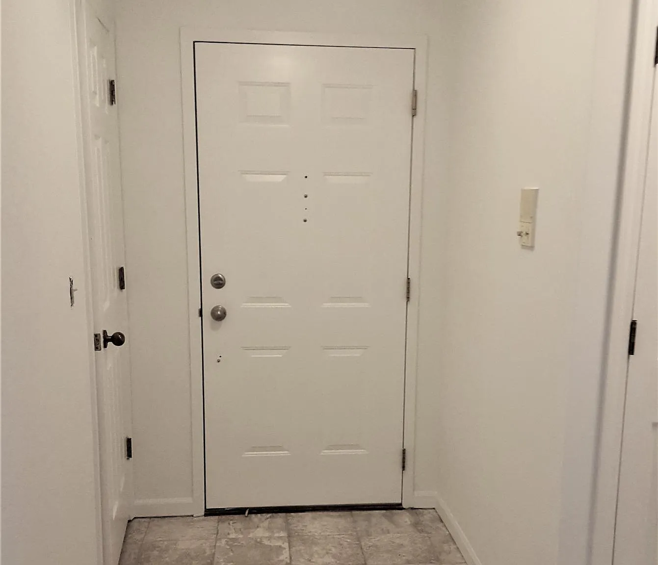 Entry hall, with coat closet and security system