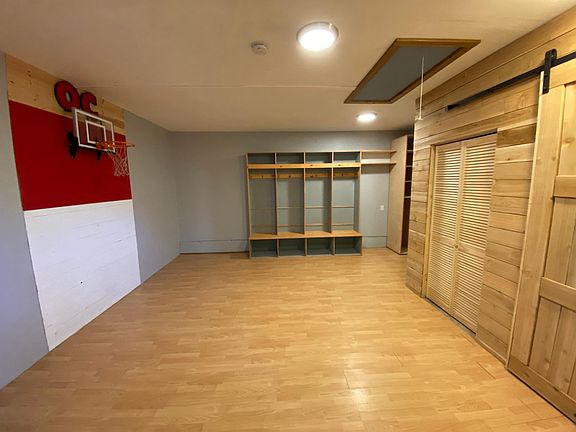 Bonus room with built in wood lockers and pantry. Attic storage and new laundry/storage closet.