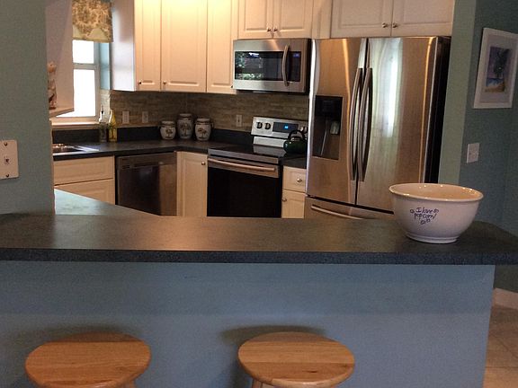 Kitchen has new stainless steel appliances, dishes, pots and pans etc.