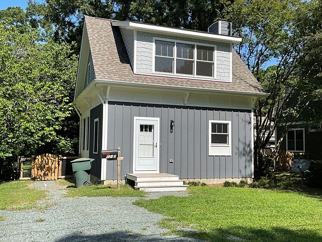 Front of house and parking area