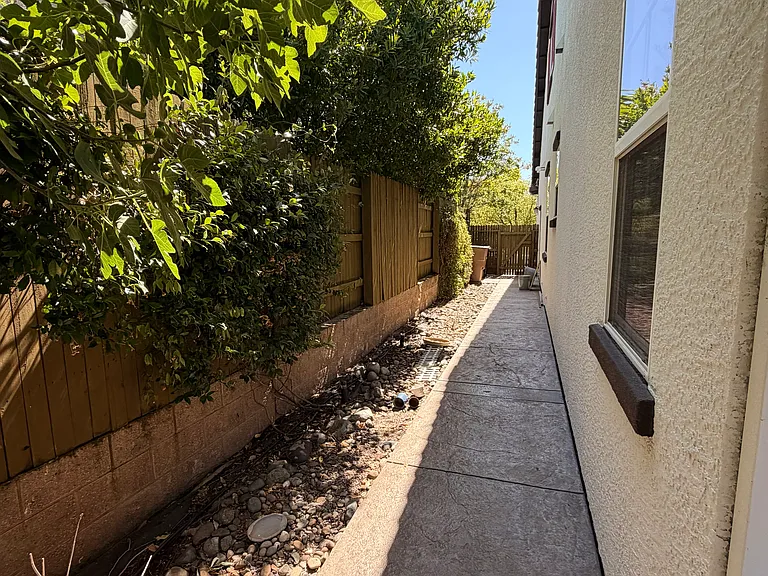 View looking along house towards front yard
