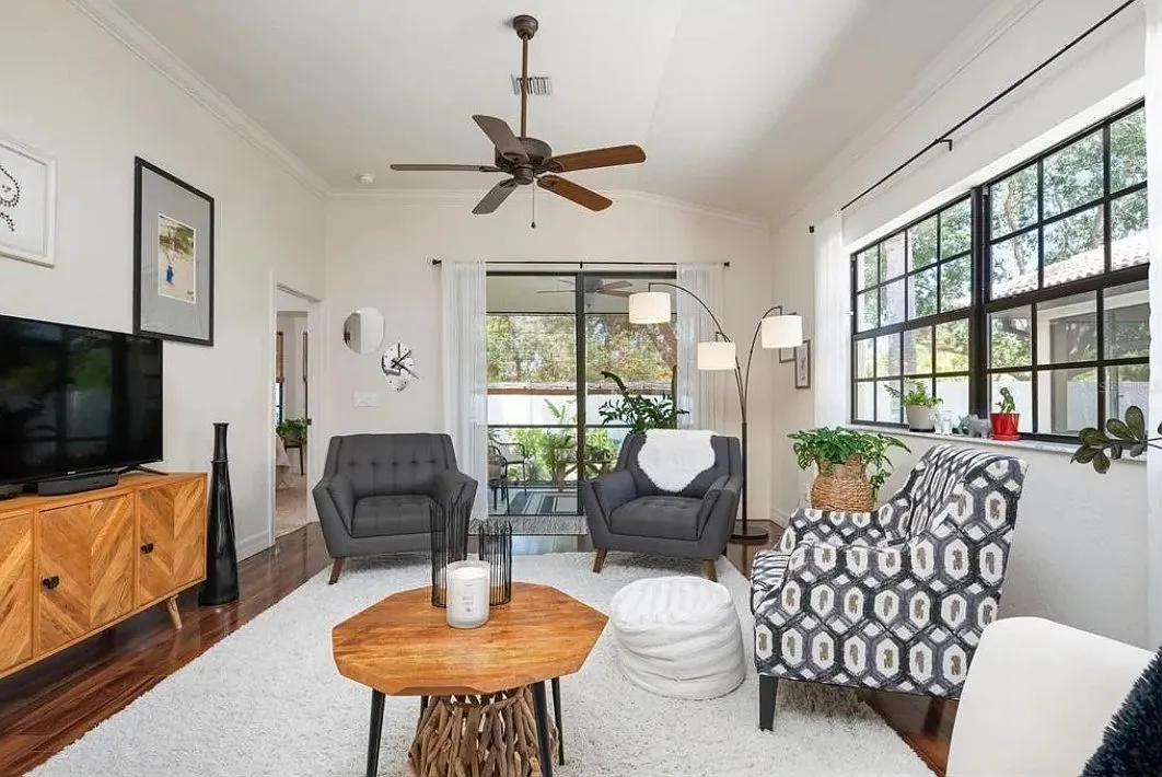 Living room with view to lanai to master - 112 Preserve Pl