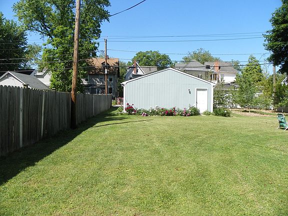 Peony gardens border the garage.