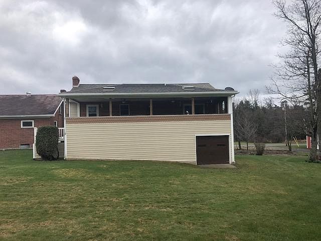 Front of House (With view of outside storage)