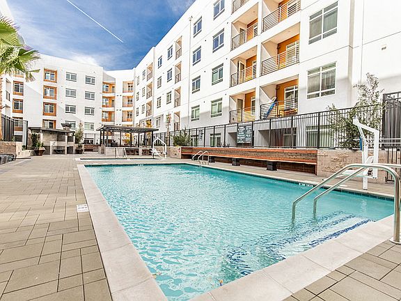 Swimming Pool and Spa surrounded by apartment homes.