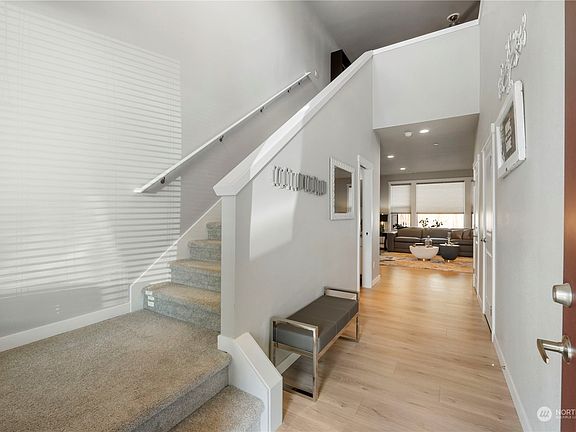 As you enter the foyer you are greeted by soaring ceilings, beautiful white millwork and gorgeous plank flooring.>