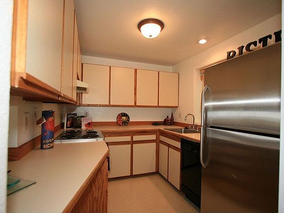The kitchen has been updated. The stainless steel refrigerator is staying.