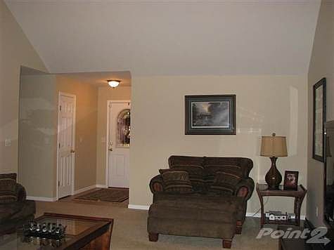 Tiled entry and vaulted ceilings in the Living Room.