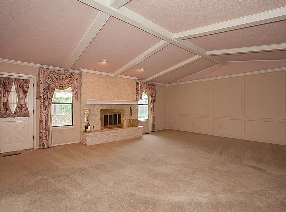 Large living room with fireplace.