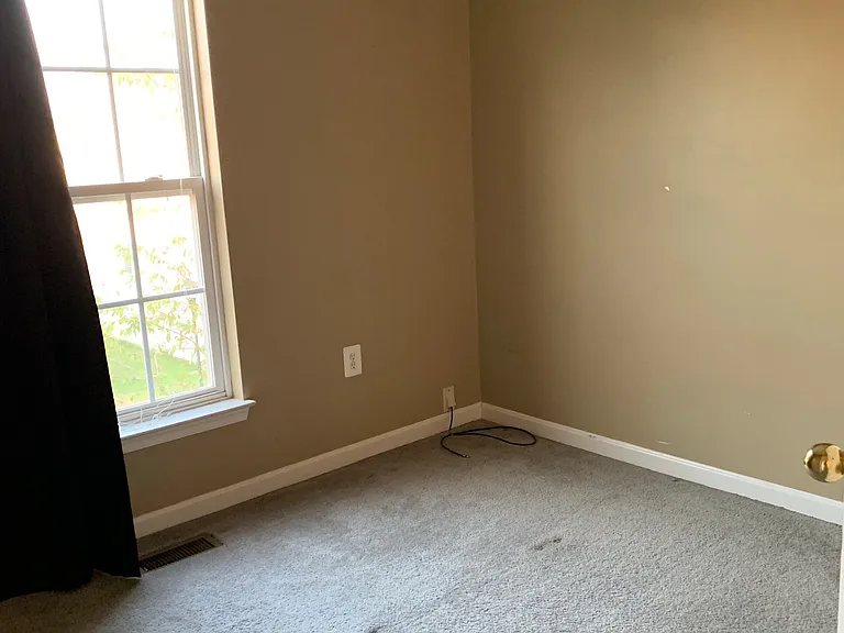 3rd bedroom, same size as 2nd, holds queen bed and desk