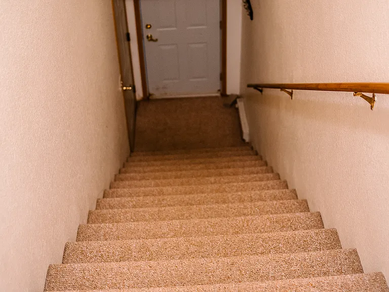 stairs to garage and front door in upper units