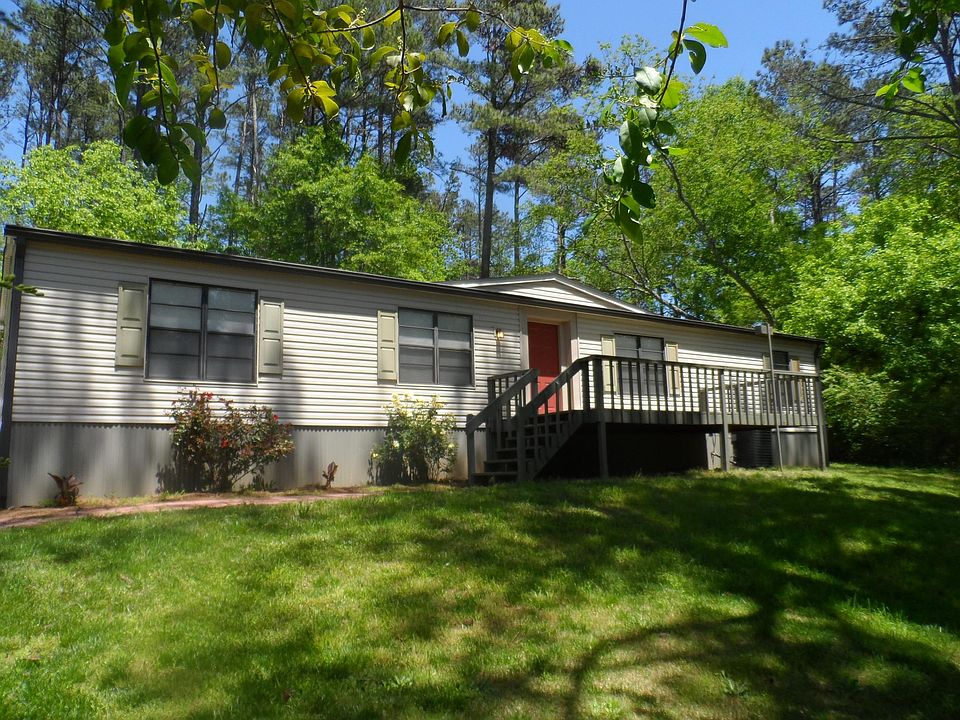 Lovely home surrounded by 3 acres of wooded beauty. 
