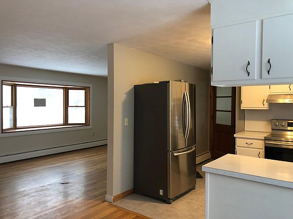 Kitchen with view of living room.