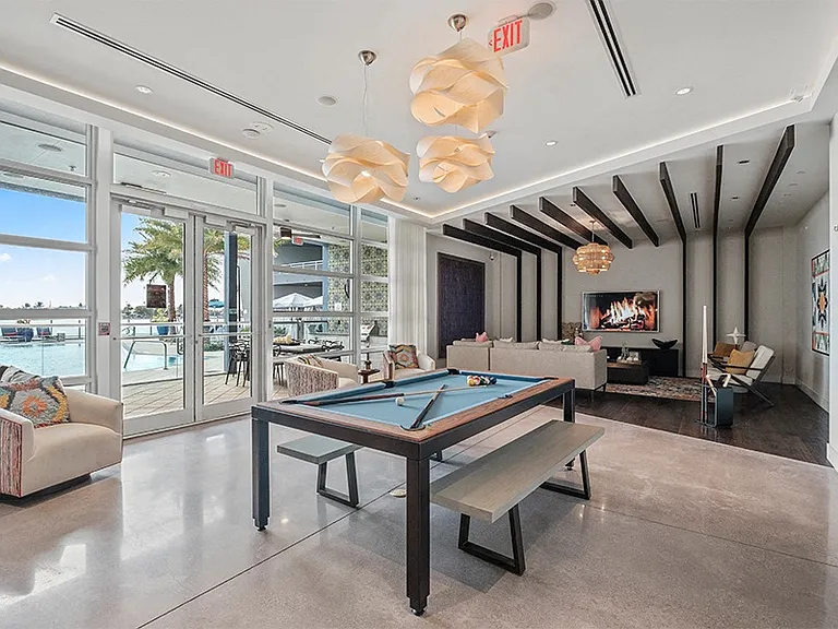 Our two-story lakefront clubhouse features TVs, billiards and an entertainment kitchen