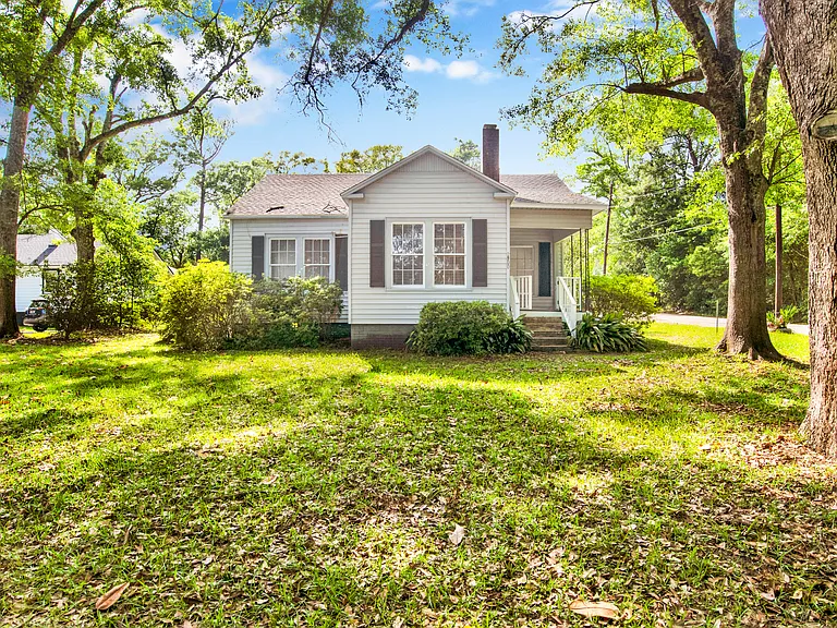 Front of house, porch, and front yard.