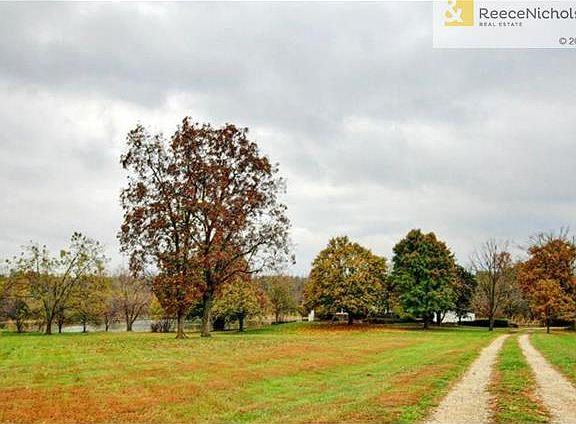 Home sits on 3.3 acres with tree-lined drive