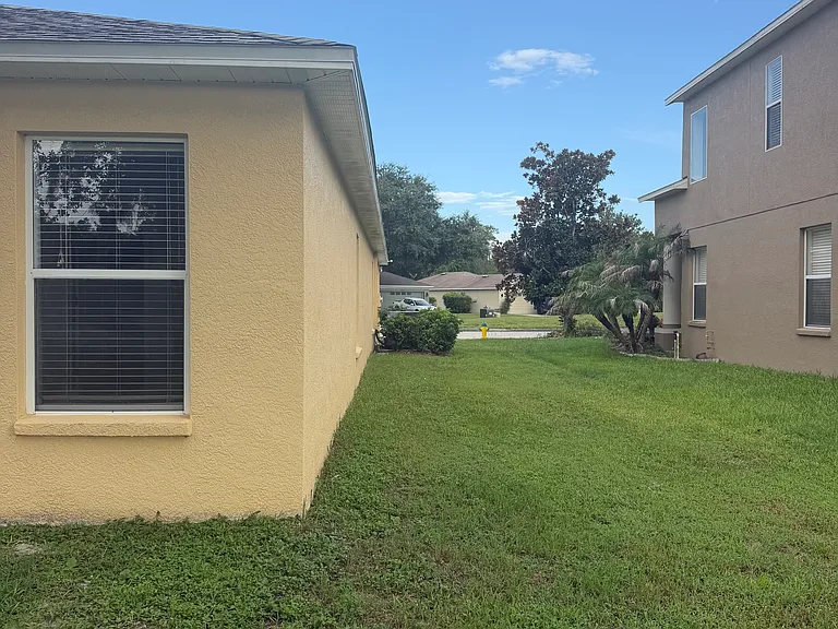 Left side of the home.