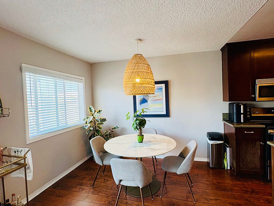 Dining area next to the kitchen. Tiny sliver of an ocean view.