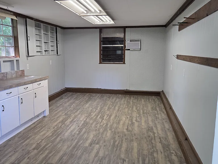 The air conditioned room in the bard can be used as a "man-cave", "she-shed", and out of house office, or even as sleeping quarters for overnight guests.