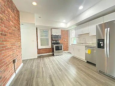Exposed brick throughout kitchen