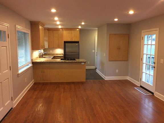 Older photo of the kitchen and dining area.